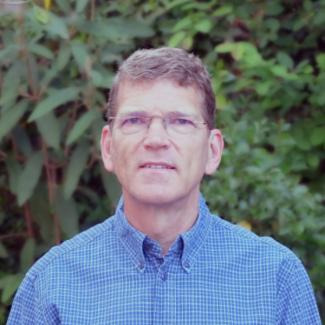 Man wearing glasses and a blue shirt