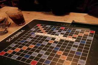 Scrabble board game with letter tiles