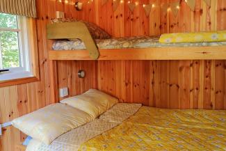 Wooden room with two bunk beds