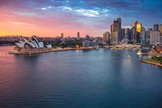 Aerial view of Sydney harbour with tall skyscrapers and open water