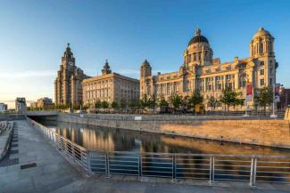 Impressive stone building overlooking a waterfront