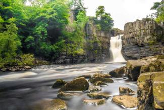 Waterfall flowing in a rock pool