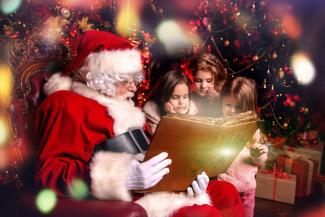 Santa reading children stories from a book