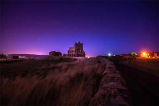 Whitby Abbey at night with beautiful night sky