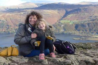 Mother and young daughter up a mountain in the Lake District