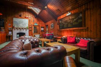 Seating area with brown chesterfield sofas