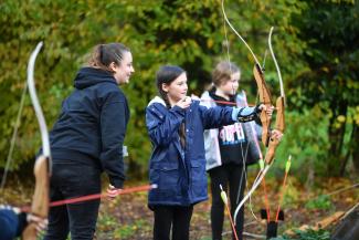 Children participating in archery activity at YHA Chester Trafford Hall