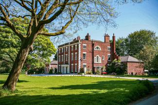 YHA Chester Trafford Hall exterior on a sunny day