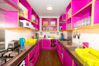 Bright pink kitchen at YHA Oxford Street