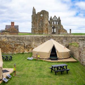 YHA Bell tent with the view of Whitby Abbey in the background