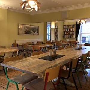 Dining room with tables and brightly coloured chairs