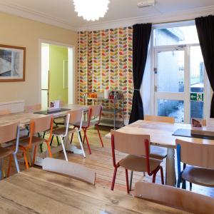 Dining room with tables and brightly coloured chairs