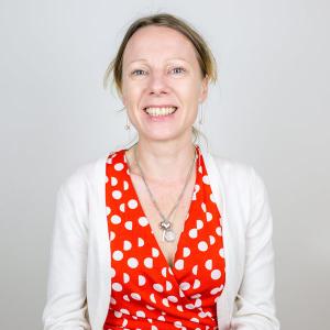 Woman wearing a red and white polka dot dress