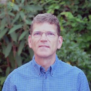 Man wearing glasses and a blue shirt