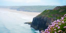 Hostel building on top of a cliff overlooking the sea