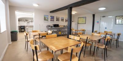 Dining area leading into a self-catering kitchen at YHA Whitby