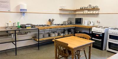 Kitchen with dining table at YHA Slaidburn