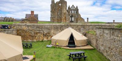 YHA Bell tent with the view of Whitby Abbey in the background