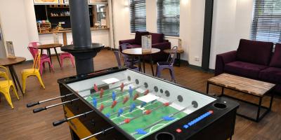 YHA London Thameside seating area with games table