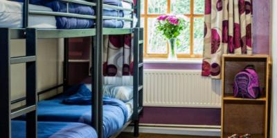 Bedroom with a set of bunk beds and a side table