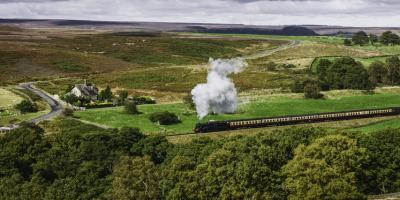 Steam train travelling through the North York Moors