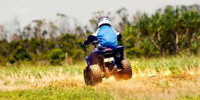 Boy having fun on a quadbike