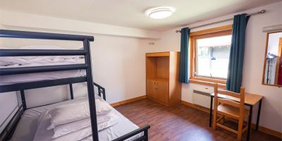 Bedroom with double bed in YHA London Lee Valley lodge