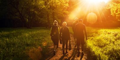 Group of walkers at sunset