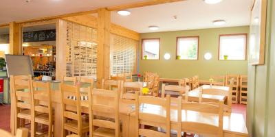 Dining room with wooden tables and chairs