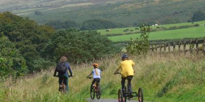 Family cycling on The Granite Way