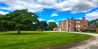 YHA Chester Trafford Hall exterior on a sunny day