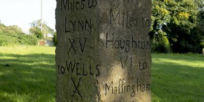 Norfolk milestone showing distance to Houghton and Wells