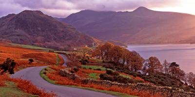 Warm panoramic autumn sunset over Buttermere in the Lake District 