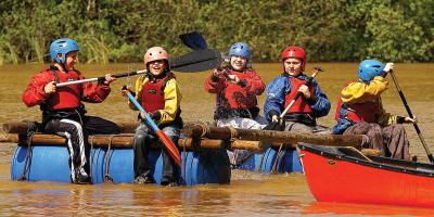 Groups of people on make-shift rafts