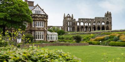 Exterior of YHA Whitby with Whitby Abbey in the background