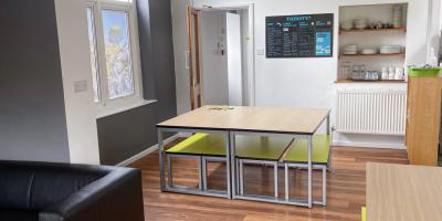 YHA Cheddar lounge area with dining space