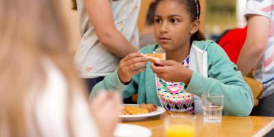 Child eating breakfast on YHA school trip