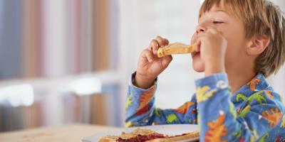 Child eating toast for breakfast