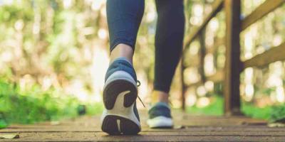 Walking wearing blue trainers