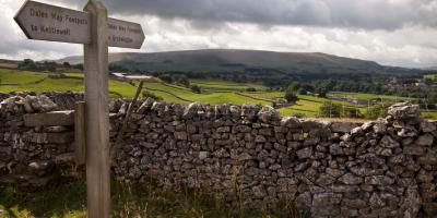 Footpath sign between Kettlewell and Grassington, with a view