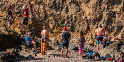 Rock climbers climbing cliff - Break Moor, Somerset