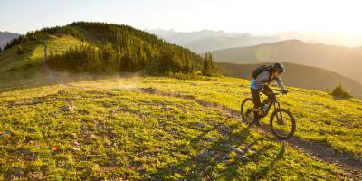 Mountain Biker on a track on the tops