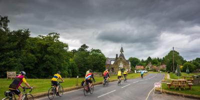 Cyclists in village in Yorkshire