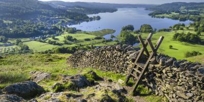 A morning shot of Lake Windermere showing the stone walling and the stile providing passage over the wall