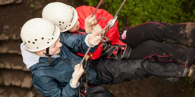 Young people abseiling at YHA Edale Activity Centre