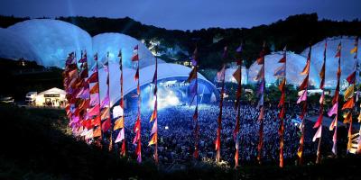 Outdoor stage in front of the Eden Project biomes at night