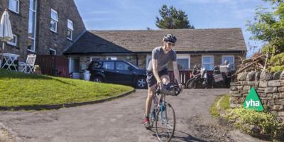 Cyclist by YHA Hawes entrance