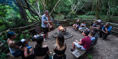 Group sitting round a campfire 