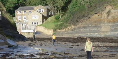 Family on the beach at YHA Boggle Hole