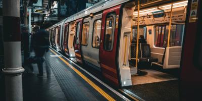 Train with open doors on a London Underground platform